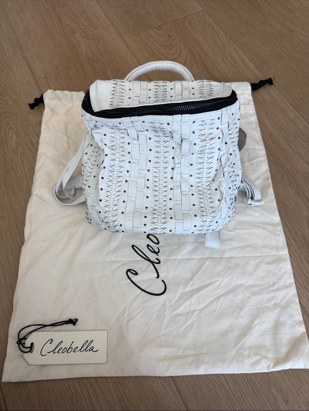 Cleobella White Woven Leather Backpack with Black Zip Accent